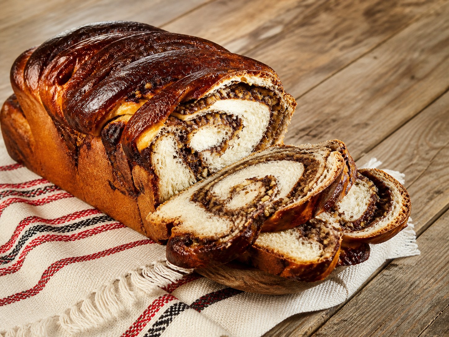 Sliced Romanian cozonac with walnut and cocoa filling